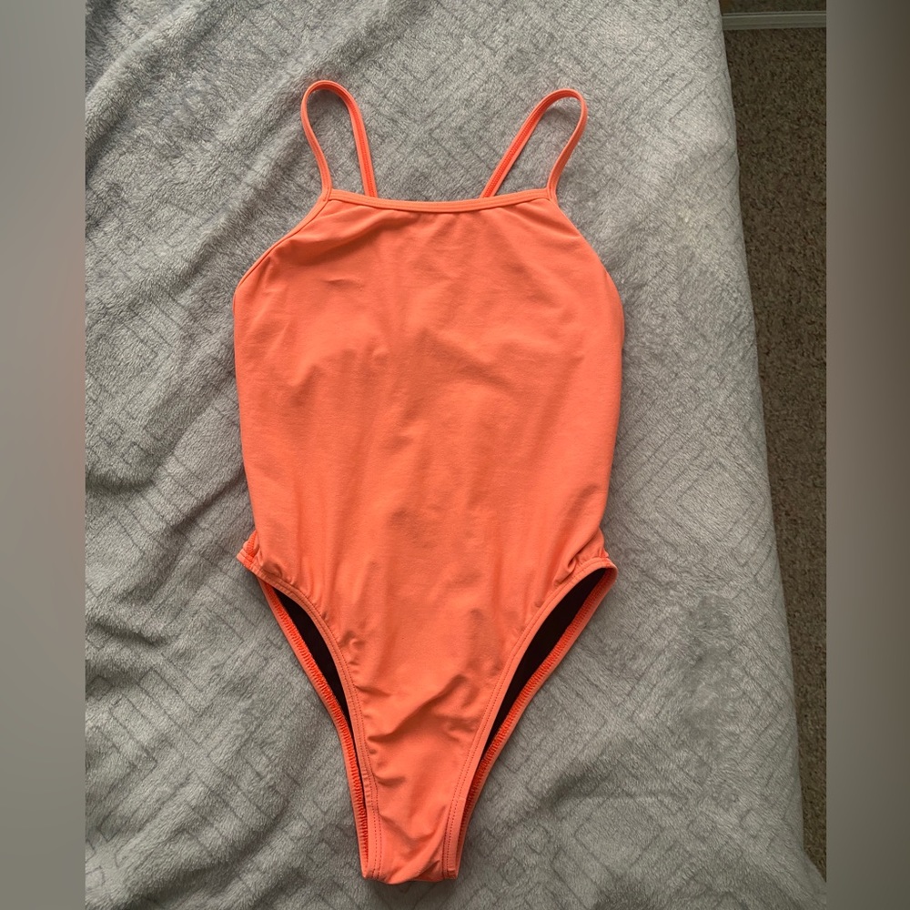 Joyln Perry suit in the color Papaya, with slim coverage.